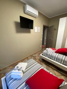 A bed or beds in a room at B&B Ares Castel Baronia