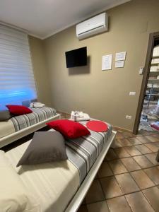 A bed or beds in a room at B&B Ares Castel Baronia