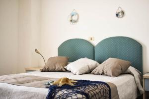 Postel nebo postele na pokoji v ubytování Hotel Embassy
