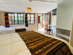 Letto o letti in una camera di Hostal Alcala
