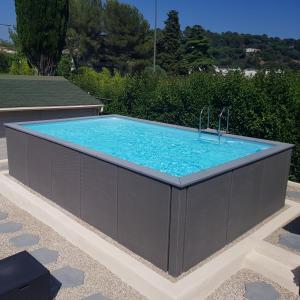 a hot tub with a sink in a backyard at Villa Ad Alta in Cannes La Bocca