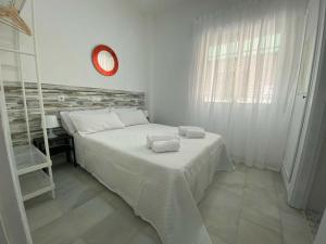 Posteľ alebo postele v izbe v ubytovaní Apartamento Pepote