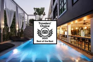 a sign that says travelers choice best of the best at a restaurant at ISTY Hotel -SHA Extra Plus in Chiang Mai