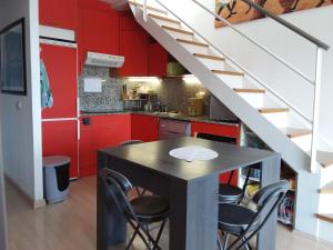 A kitchen or kitchenette at GMID IMMO A187 Apartamento Port Canigo