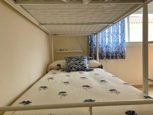 A bed or beds in a room at Casa Valdelagrana Playa