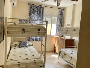 A bed or beds in a room at Casa Valdelagrana Playa