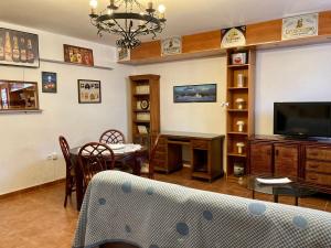 A television and/or entertainment centre at Casa Valdelagrana Playa