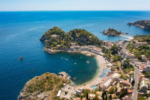 an aerial view of a small island in the ocean at Mazzarò Sea Palace - VRetreats in Taormina