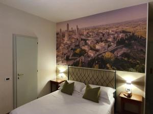 Voodi või voodid majutusasutuse Hotel Le Colline toas