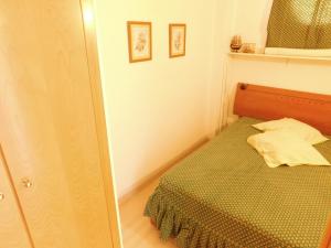 A bed or beds in a room at GMID IMMO A187 Apartamento Port Canigo