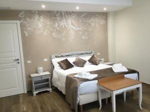 Postel nebo postele na pokoji v ubytování CAVALIERE suite & rooms