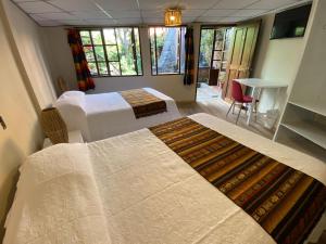 Letto o letti in una camera di Hostal Alcala