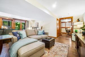 a living room with a couch and a table at Volunteer Park Vacation in Seattle