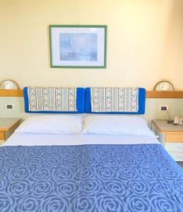 Postel nebo postele na pokoji v ubytování Tramonti Residence