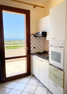 Kuchyň nebo kuchyňský kout v ubytování Tramonti Residence + 37 fotografií