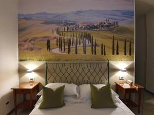Voodi või voodid majutusasutuse Hotel Le Colline toas
