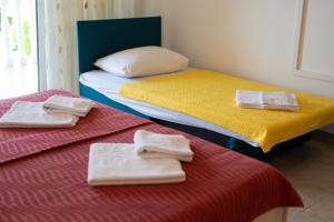 Postel nebo postele na pokoji v ubytování Apartments Ivica Krk Island