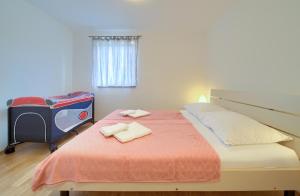 Postel nebo postele na pokoji v ubytování Apartments Ivica Krk Island