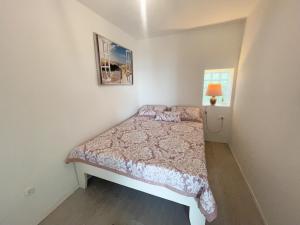 Postel nebo postele na pokoji v ubytování Apartmani Fabijan&Florijan