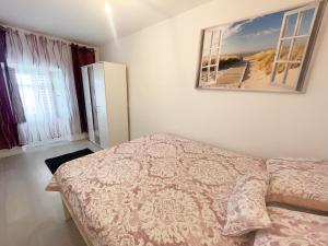 Postel nebo postele na pokoji v ubytování Apartmani Fabijan&Florijan