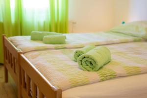 Postel nebo postele na pokoji v ubytování Apartman Mihael