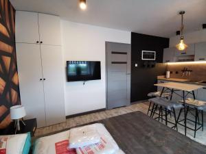 Kuchyňa alebo kuchynka v ubytovaní Apartamenty Majówka