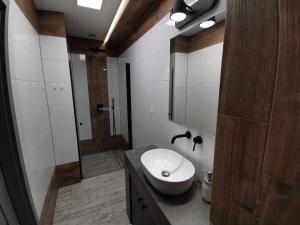 Kúpeľňa v ubytovaní Apartamenty Majówka