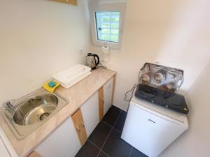 Kuchyň nebo kuchyňský kout v ubytování Apartmani Fabijan&Florijan + 37 fotografií
