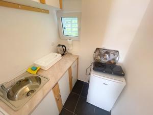 Kuchyň nebo kuchyňský kout v ubytování Apartmani Fabijan&Florijan