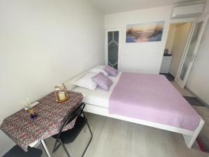 Postel nebo postele na pokoji v ubytování Apartmani Fabijan&Florijan