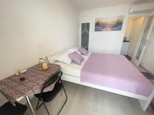 Postel nebo postele na pokoji v ubytování Apartmani Fabijan&Florijan