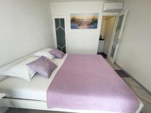 Postel nebo postele na pokoji v ubytování Apartmani Fabijan&Florijan