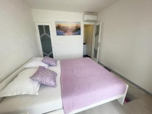 Postel nebo postele na pokoji v ubytování Apartmani Fabijan&Florijan