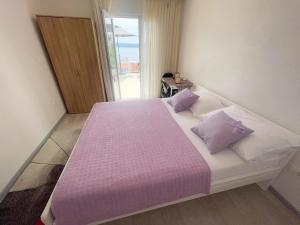 Postel nebo postele na pokoji v ubytování Apartmani Fabijan&Florijan