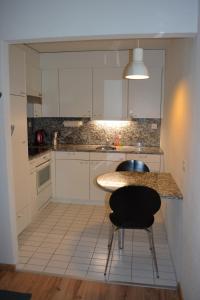 Kuchyň nebo kuchyňský kout v ubytování Apartment Residenza Quadra Flims