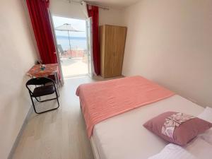 Postel nebo postele na pokoji v ubytování Apartmani Fabijan&Florijan