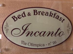 サン・サルヴォにあるB&B Incantoの客室内のベッド&ブレックファーストの看板