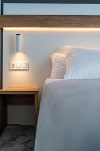 Una cama o camas en una habitación de Hotel Silva