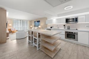 a kitchen with a large island in the middle at 1 Bedroom Ocean View located at 1 Hotel & Homes Miami Beach -1012 in Miami Beach