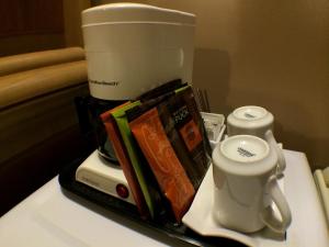 a coffee maker sitting on top of a counter at King's Motel & Restaurant in St. Paul