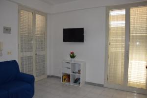 TV a/nebo společenská místnost v ubytování Casa Riviera