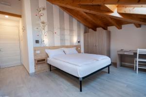 Postel nebo postele na pokoji v ubytování B&B da Sabry e Gian
