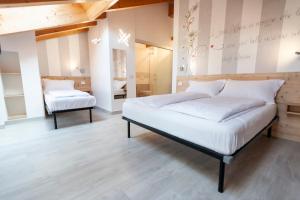 Postel nebo postele na pokoji v ubytování B&B da Sabry e Gian