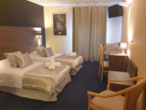 Ένα ή περισσότερα κρεβάτια σε δωμάτιο στο Le Patio De La Dordogne