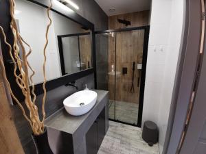 Kúpeľňa v ubytovaní Apartamenty Majówka