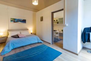 Posteľ alebo postele v izbe v ubytovaní Siciliabedda Catania Holiday House