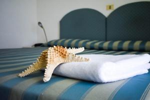Postel nebo postele na pokoji v ubytování Hotel Embassy