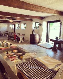 a kitchen with a counter with food on it at Pensionat Haga Öland in Löttorp