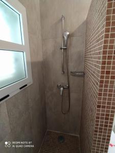 a bathroom with a shower with a glass door at Casitas La Condesa in Valle Gran Rey