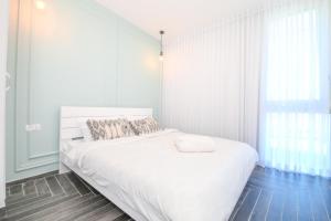 Postel nebo postele na pokoji v ubytování Caesarea :In the front of the sea + 29 fotografií